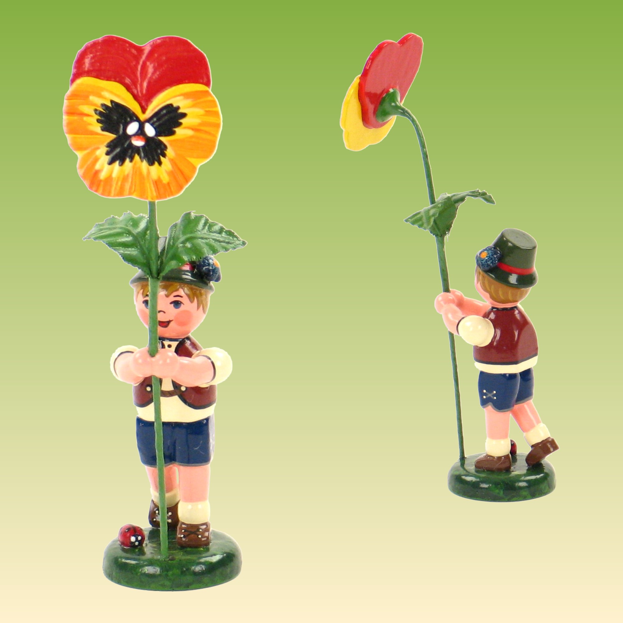 Blumenkind Junge mit Stiefmütterchen