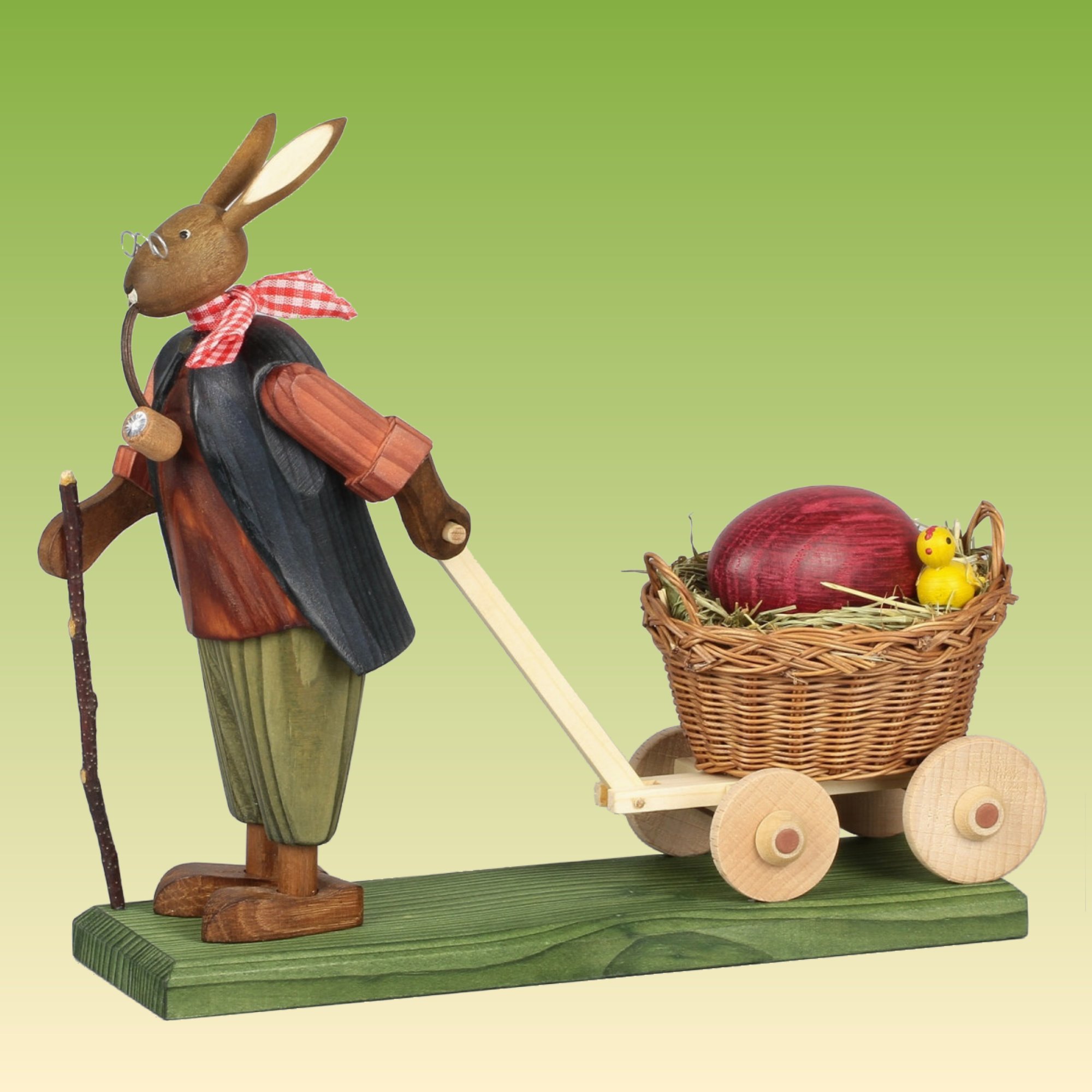 Hasengroßvater mit großem Ei im Wagen