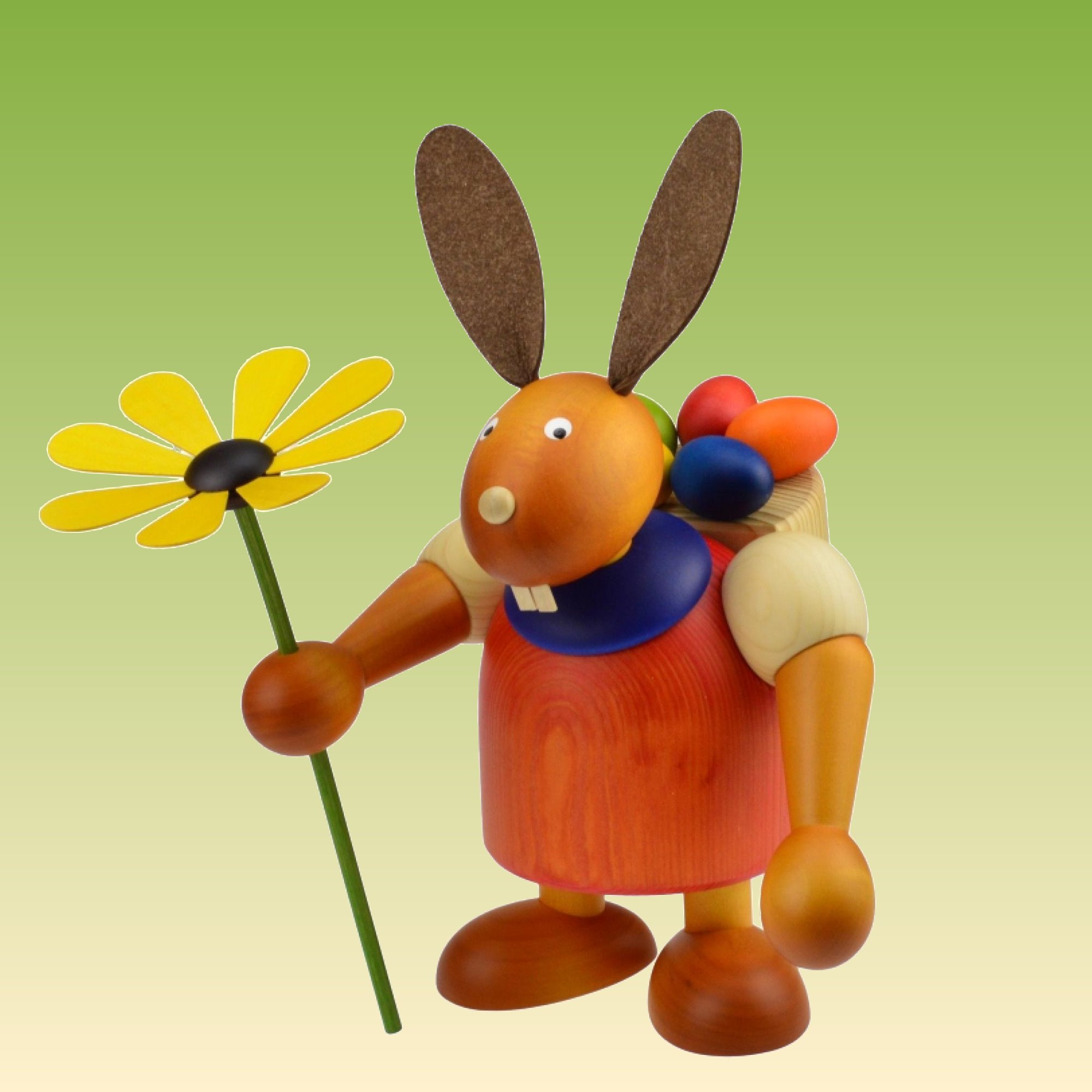 Hase mit Eierkiepe und Blume