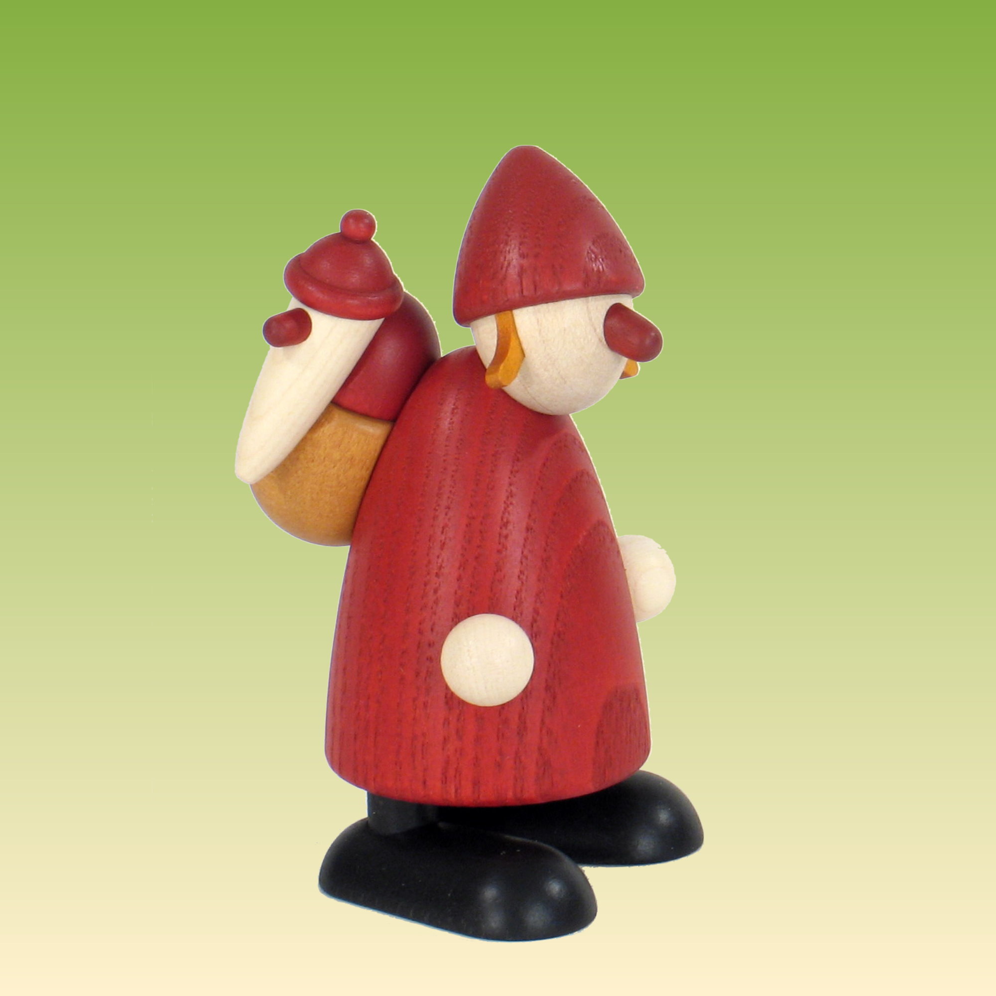 Weihnachtsfrau mit Kind auf Rücken